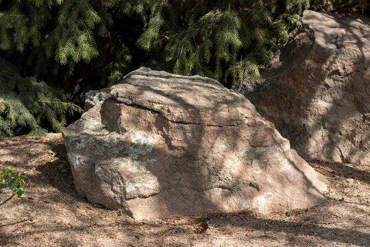 Large isolated boulder for landscape use in a community