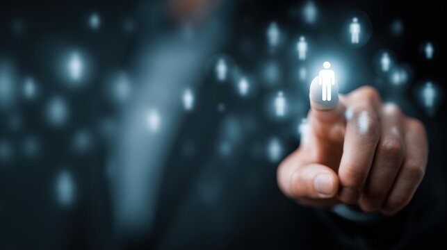 Hand pointing at a luminous human icon within a digital social network interface.