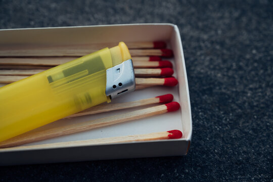 Close-up view of a matchbox with red-tipped matches