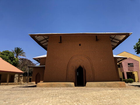 Zaria, Nigeria - 22 March 2026: View of the historic St. Bartholomew's Church in Wusasa featuring traditional mud architecture under a clear blue sky.