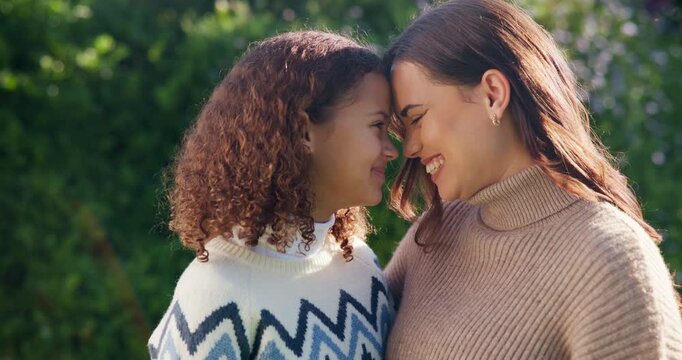 Outdoor, happy and mom with child, love and laugh with daughter and confident with family connection. Woman, forehead touch and embrace with kid in backyard, care and together on weekend in nature