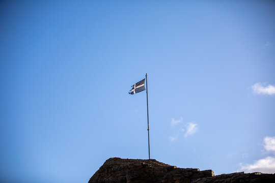 Flag of St Piran Flying Above Perranporth Beach in Cornwall, UK