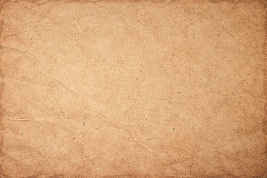 Vintage brown paper texture background with detailed crumpled creased pattern and burnt edges for old manuscript mockup
