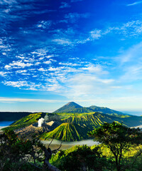 Obraz premium Mount Bromo Volcanic Eruption Smoke Plume at Sunrise Sea of Sand East Java