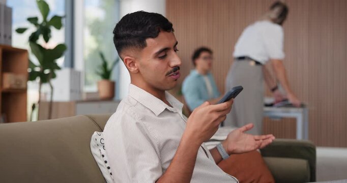 Voice note, phone and man on sofa in office with communication, networking or contact on mobile app. Talking, technology and male editor with cellphone for online audio message at startup agency.