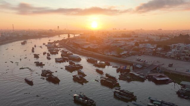 Aerial view of Cai Rang floating market. CaiRang is famous market in mekong delta, Can Tho, Vietnam. Tourists, people buy and sell food, vegetable, fruits on boat, ship. The vibrant scene, crowded