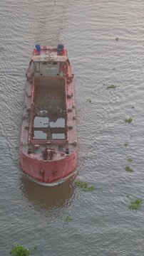 Aerial view of Cai Rang floating market. CaiRang is famous market in mekong delta, Can Tho, Vietnam. Tourists, people buy and sell food, vegetable, fruits on boat, ship. The vibrant scene, crowded
