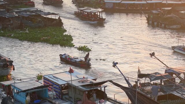 Aerial view of Cai Rang floating market. CaiRang is famous market in mekong delta, Can Tho, Vietnam. Tourists, people buy and sell food, vegetable, fruits on boat, ship. The vibrant scene, crowded