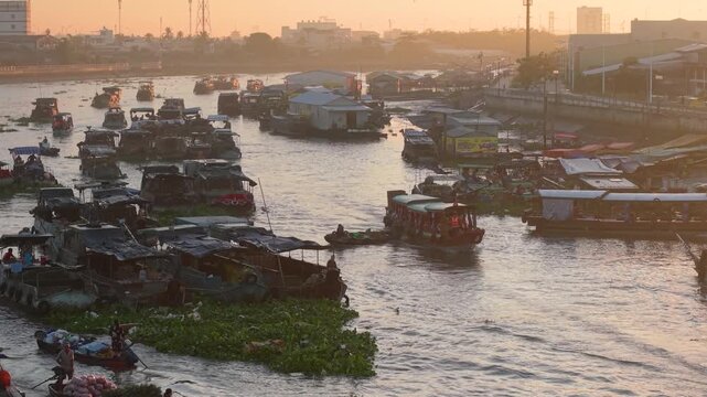 Aerial view of Cai Rang floating market. CaiRang is famous market in mekong delta, Can Tho, Vietnam. Tourists, people buy and sell food, vegetable, fruits on boat, ship. The vibrant scene, crowded