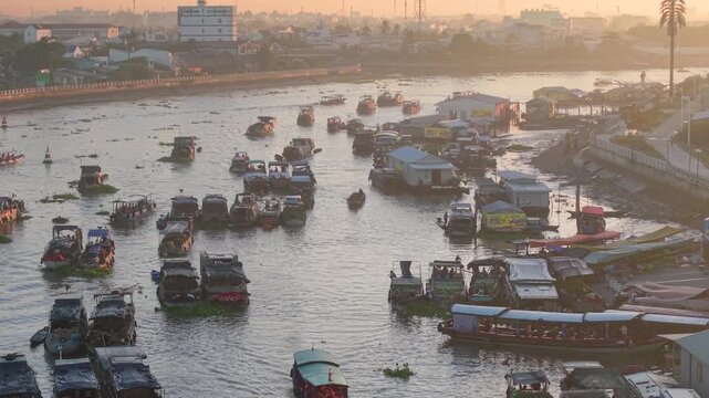 Aerial view of Cai Rang floating market. CaiRang is famous market in mekong delta, Can Tho, Vietnam. Tourists, people buy and sell food, vegetable, fruits on boat, ship. The vibrant scene, crowded
