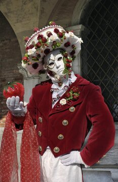 Mask with strawberries at carneval in Venice, Italy