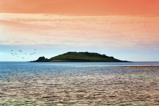 Coastline, uninhabited island, rocks in the sea, backlight, Isles of Scilly, Cornwall, England, Great Britain