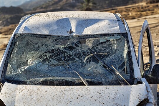 Car, shattered windscreen, total loss after flood, flood damage after flood disaster in Almeria, storm 2012, Andalusia, Spain