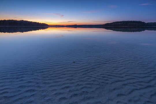 Lake F&uuml;rstensee, clear water with wave structure in the sand, sunset, M&uuml;ritz National Park, F&uuml;rstensee, Mecklenburg-Western Pomerania, Germany