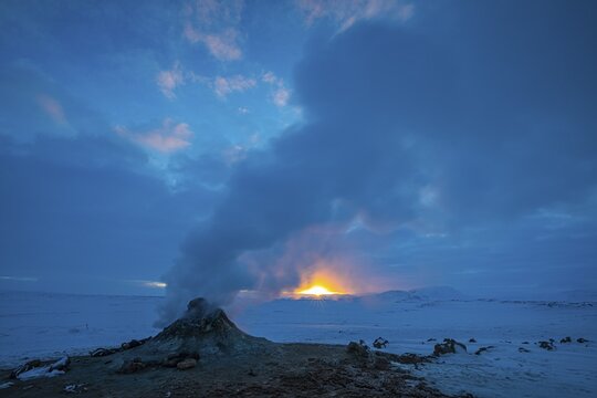 Mud pot with steam source at sunrise, Hverir solfataras field, fumaroles, snow-covered geothermal area, Northern Iceland Eyestra, Iceland