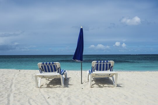 Sun loungers on world class Shoal Bay East beach, Anguilla, Caribbean, British Oversea territory, United Kingdom