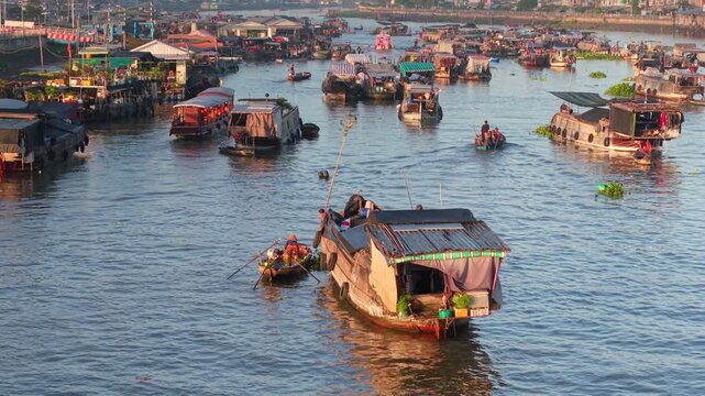 Aerial view of Cai Rang floating market. CaiRang is famous market in mekong delta, Can Tho, Vietnam. Tourists, people buy and sell food, vegetable, fruits on boat, ship. The vibrant scene, crowded