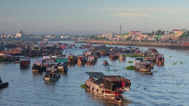 Aerial view of Cai Rang floating market. CaiRang is famous market in mekong delta, Can Tho, Vietnam. Tourists, people buy and sell food, vegetable, fruits on boat, ship. The vibrant scene, crowded