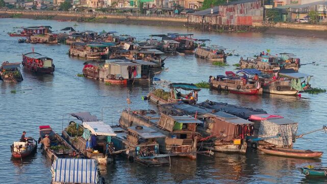 Aerial view of Cai Rang floating market. CaiRang is famous market in mekong delta, Can Tho, Vietnam. Tourists, people buy and sell food, vegetable, fruits on boat, ship. The vibrant scene, crowded
