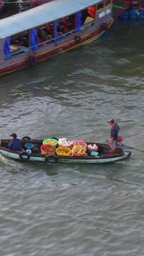Aerial view of Cai Rang floating market. CaiRang is famous market in mekong delta, Can Tho, Vietnam. Tourists, people buy and sell food, vegetable, fruits on boat, ship. The vibrant scene, crowded