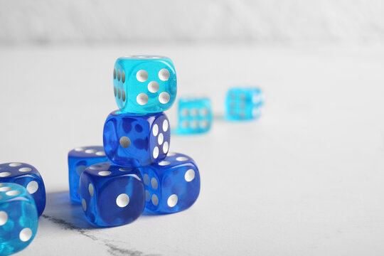 Blue dices on light background