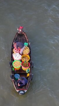 Aerial view of Cai Rang floating market. CaiRang is famous market in mekong delta, Can Tho, Vietnam. Tourists, people buy and sell food, vegetable, fruits on boat, ship. The vibrant scene, crowded