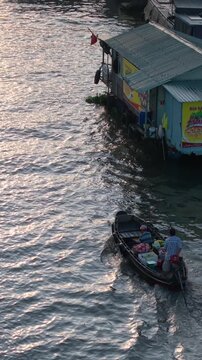 Aerial view of Cai Rang floating market. CaiRang is famous market in mekong delta, Can Tho, Vietnam. Tourists, people buy and sell food, vegetable, fruits on boat, ship. The vibrant scene, crowded