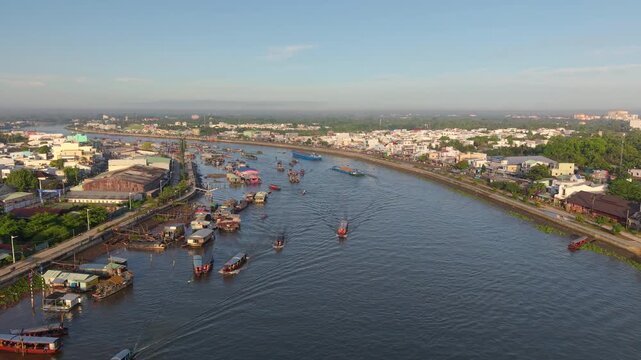Aerial view of Cai Rang floating market. CaiRang is famous market in mekong delta, Can Tho, Vietnam. Tourists, people buy and sell food, vegetable, fruits on boat, ship. The vibrant scene, crowded