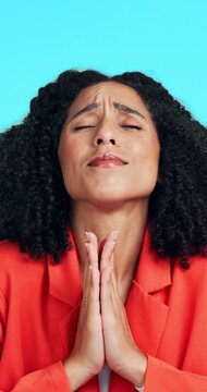 Woman, prayer and wish in studio for hope, luck and request God for help on blue background. Person, praying and fingers crossed for assistance with religion, spiritual guidance or faith for miracle