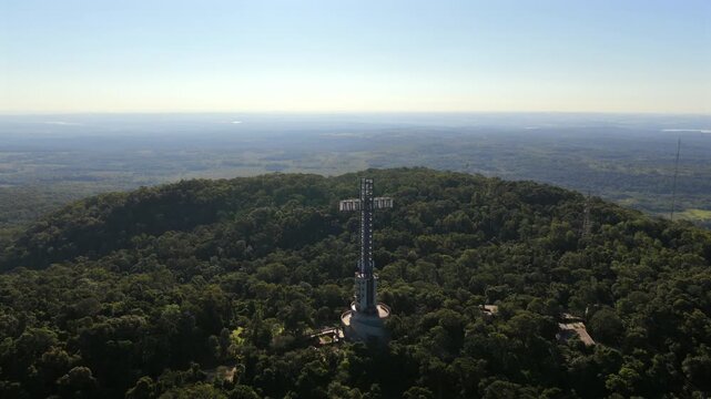 Parque Tem&aacute;tico de la Cruz in Santa Ana Misiones Argentina rising above Selva Paranaense rainforest canopy with panoramic subtropical landscape and observation tower landmark, drone orbit aerial shot