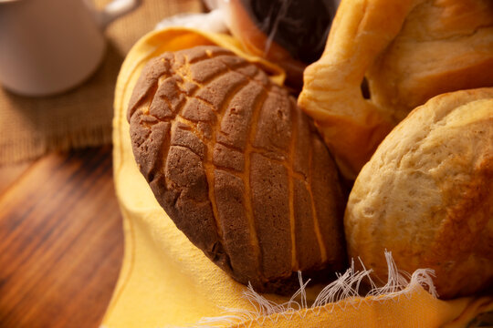 Concha bread. Mexican sweet bread roll with seashell-like appearance, Usually eaten with coffee or hot chocolate at breakfast or as an afternoon snack.