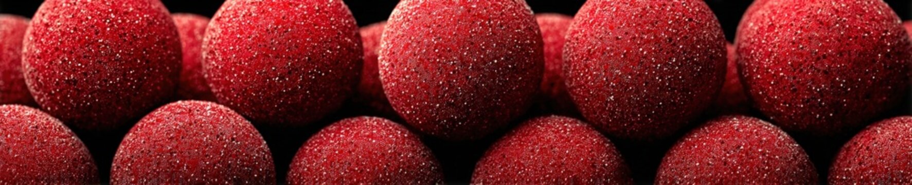 Macro photograph of a dense cluster of erythrocytes under a scanning electron microscope showing vibrant scarlet color and velvety surface texture.