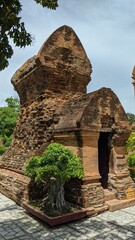 Obraz premium Heritage site in Nha Trang, Vietnam: Ancient Champa Kingdom's Po Nagar Towers surrounded by lush greenery