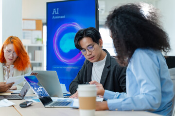 Naklejka na ściany i meble Diverse creative team use Ai Assistant (artificial intelligence assistant) on AI-assisted display for Marketing Data Analyst meeting at office.Coding team,develop Ai Assistant,business brainstorming