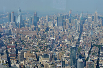Obraz premium Skyline Street Scene. Urban Corridor With Towering Structures And Dense City Grid new york