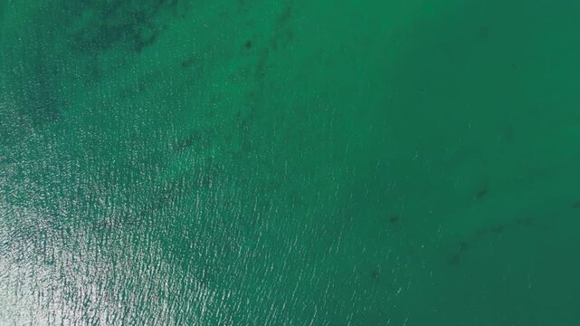 Seddulbahir, Eceabat, Turkey. Seddulbahir Fortress, stone bastions and ramparts on a coastal promontory, aerial drone view over turquoise Dardanelles waters. Aerial View, MasterShots, Tilt up