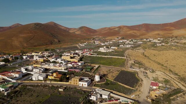 Aerial Pull Back from Traditional Stone Windmill in Tiscamanita, Fuerteventura, Spain