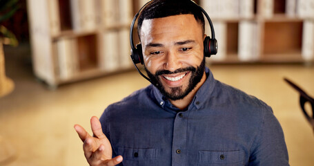Obraz premium Telemarketing, man and smile with headset in call center for agent, explain service and offer. Friendly, sales consultant and chat to outbound client for lead generation, negotiation and closing deal