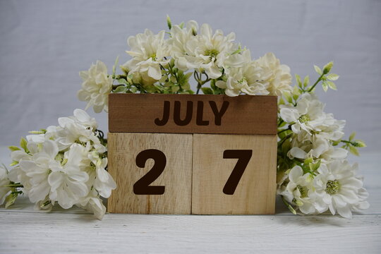 Wooden Calendar Showing the Date of July 27th. Day 27 of July month