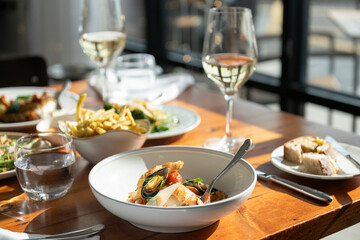 Delightful Seafood Feast at a Sunny Restaurant With Fine Wine and Fresh Flavors