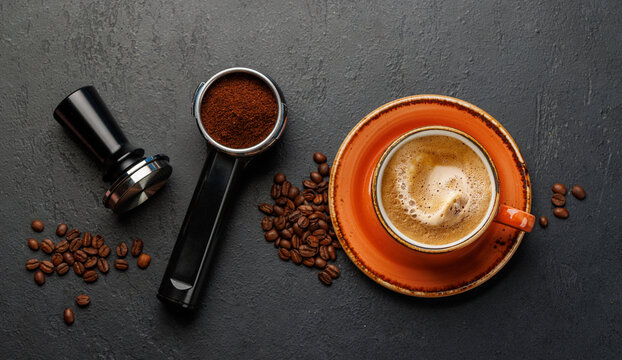 Espresso preparation tools and coffee beans flat lay composition
