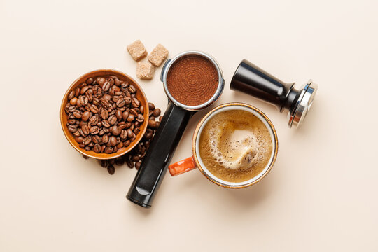 Espresso coffee setup with beans tamper and portafilter top view