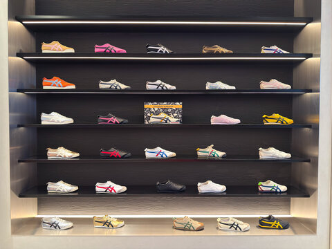 Kuala Lumpur, Malaysia - April 12, 2026: Onitsuka Tiger Colorful Sneaker Collection Wall Display in Luxury Shoe Store