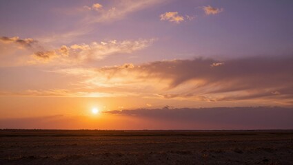 Obraz premium Sunrise over barren landscape with expansive open foreground