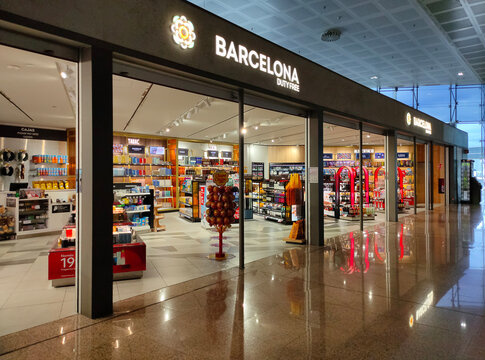 Barcelona, Spain - May 5, 2026: Modern interior with cosmetics and perfume fashion brand stores in Duty Free at El Prat Barcelona International airport. Spain