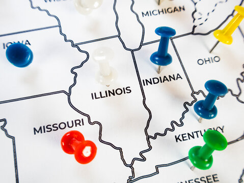 Macro close-up of a US Midwest regional map focusing on Indiana, Illinois, Missouri, and Ohio with colorful push pins. Perfect for corporate demographics, target marketing, and regional logistics.