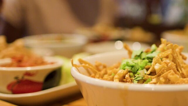 Northern Thai Khao Soi Curry Noodle Soup in a Ceramic Bowl