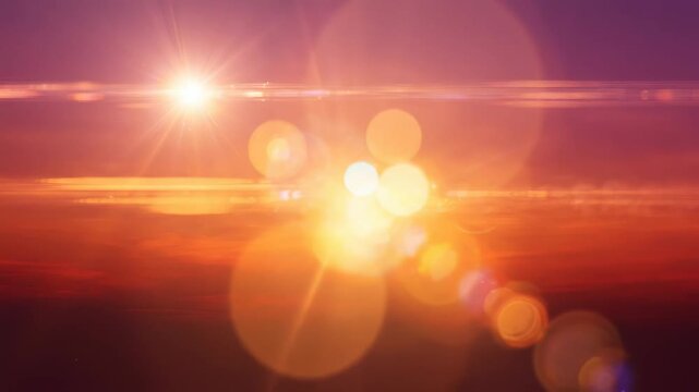 夕暮れの光彩が広がる温かなレンズフレア背景