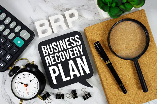 BRP - Business Recovery Plan acronym with calculator, alarm clock and magnifying glass, Business concept background