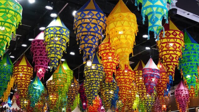Colorful Thai paper lanterns hanging indoors, festival decoration